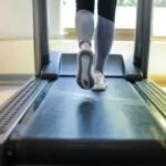A modern foldable treadmill in a sleek home gym