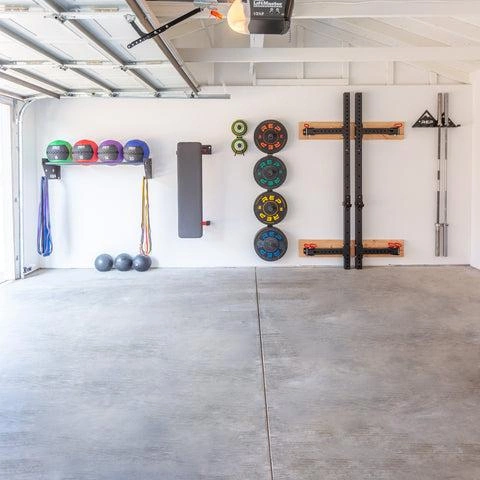 Outdoor Gym Ideas for Backyards: 15 Stylish & Practical Setups 18 Home gym wall storage system holding resistance bands and workout equipment